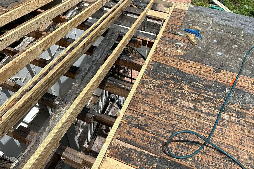Residential roofing contractor installing and repairing a home roof