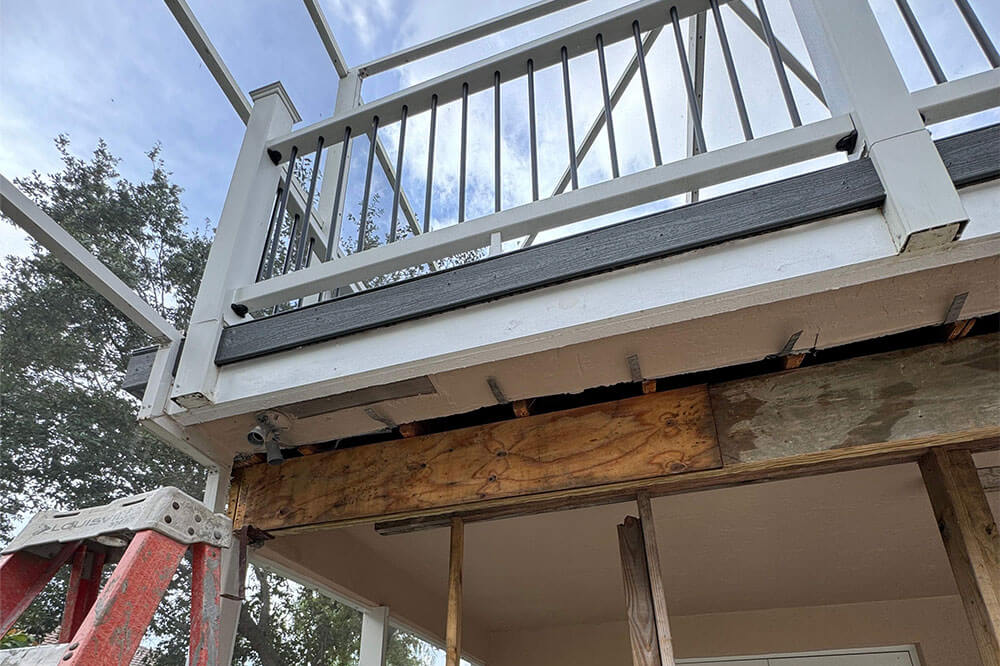 Roof replacement contractor installing new roofing materials on a residential home