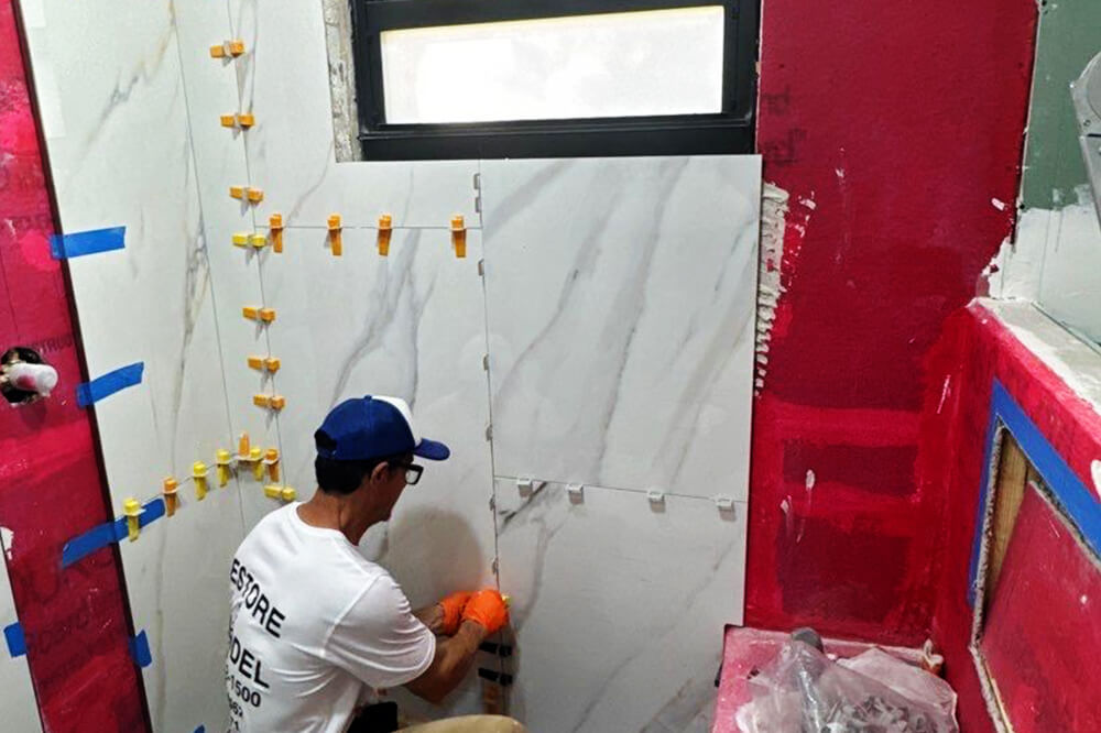 Structural repair contractor inspecting and repairing building damage