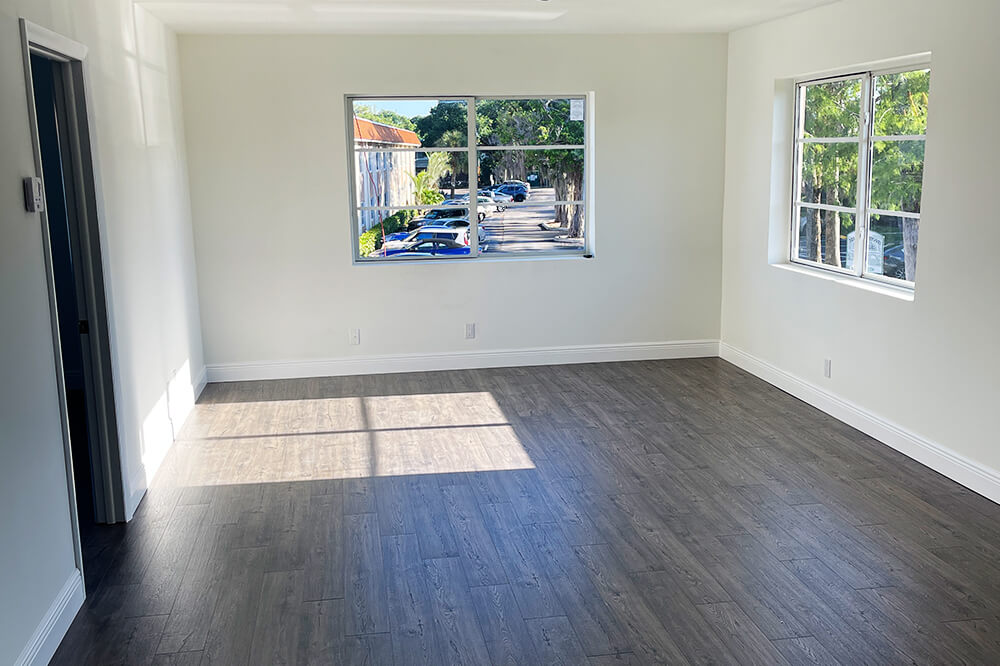 Flooring installation contractor installing new flooring in a residential home